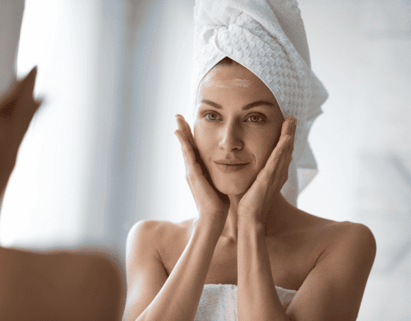 The right facial care from 30. woman applying face cream